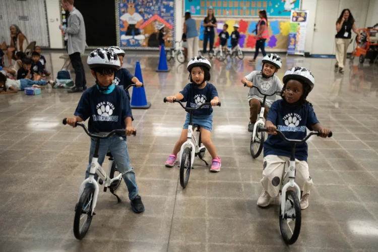 A childhood rite moves indoors as kindergartners  learn to ride bikes in school gyms
